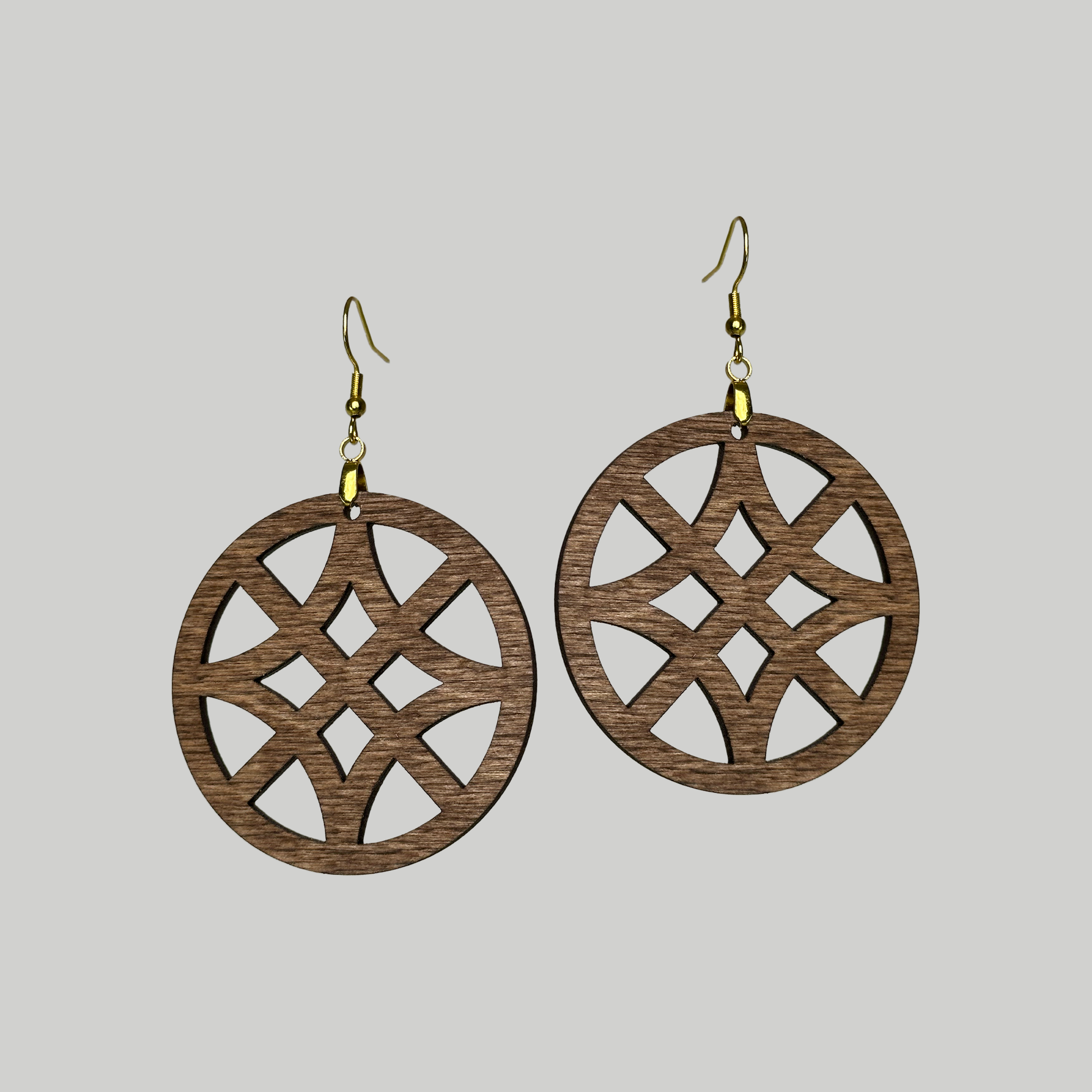 Circle Window Pattern Earrings: Stylish and modern, these earrings feature a captivating circle window pattern for a contemporary look.