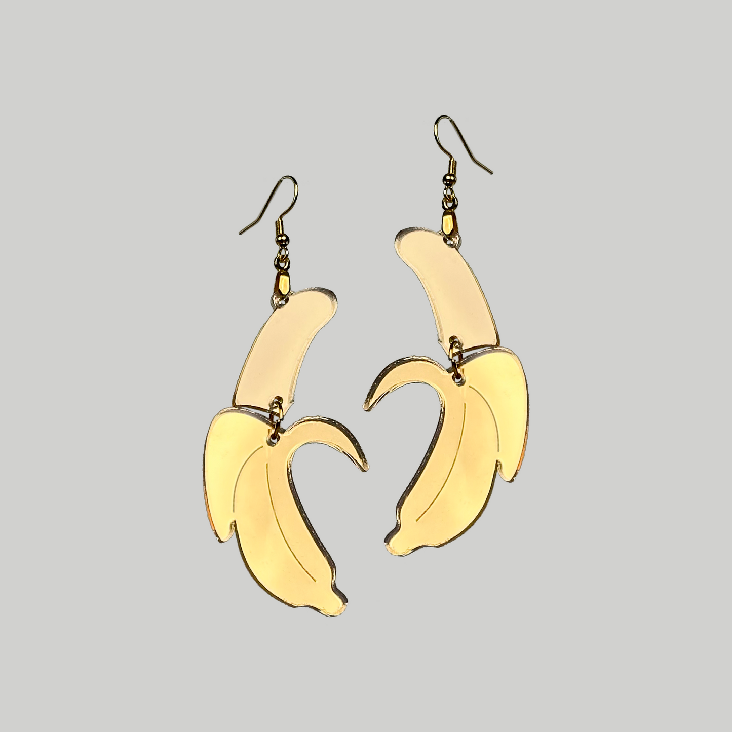 Banana Earrings: Playful and tropical, these banana-shaped earrings add a touch of fun to your accessory collection.