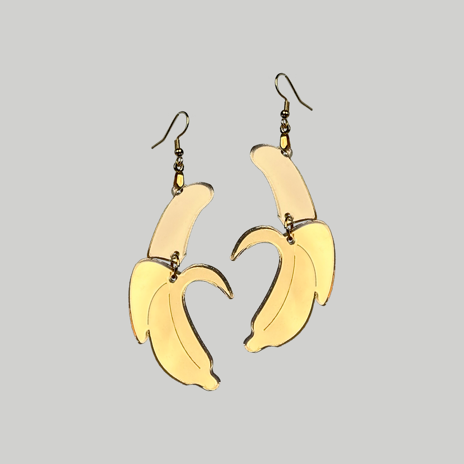 Banana Earrings: Playful and tropical, these banana-shaped earrings add a touch of fun to your accessory collection.