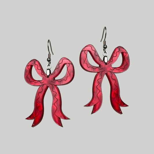 Red Bow Earrings: Chic and playful, these earrings feature stylish red bows for a touch of festive and fashionable charm.