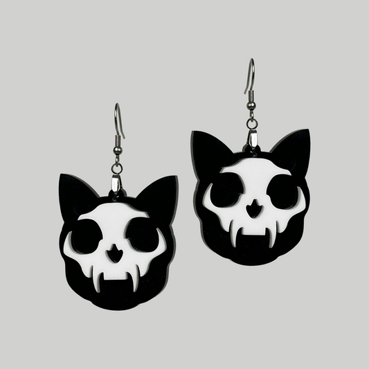 Layered Cat Skull Earrings: Distinctive, these earrings feature a two-layered design with cat skull motifs for a bold statement.