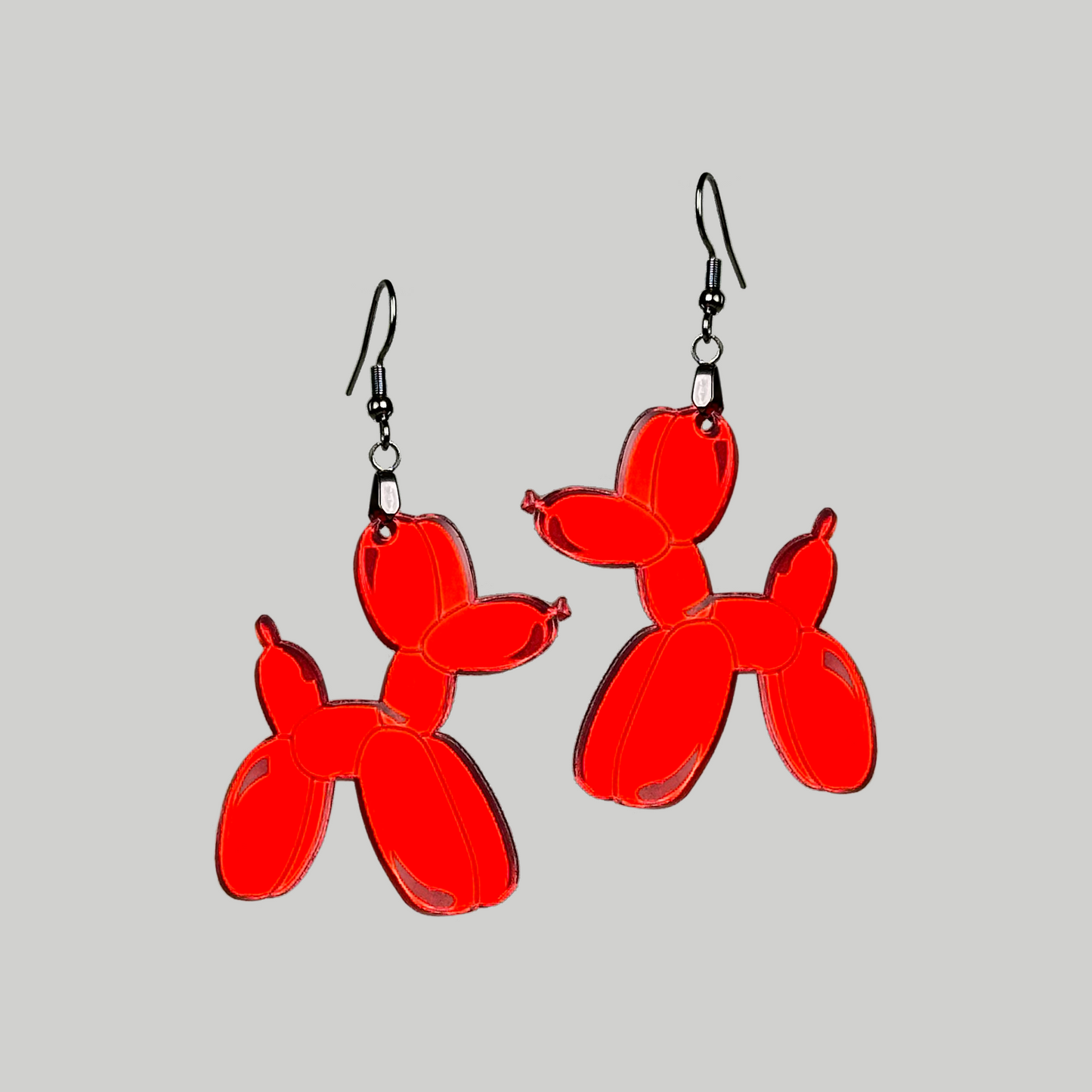 Earrings featuring a balloon animal-shaped dog, a playful and charming accessory to showcase your love for whimsical design.