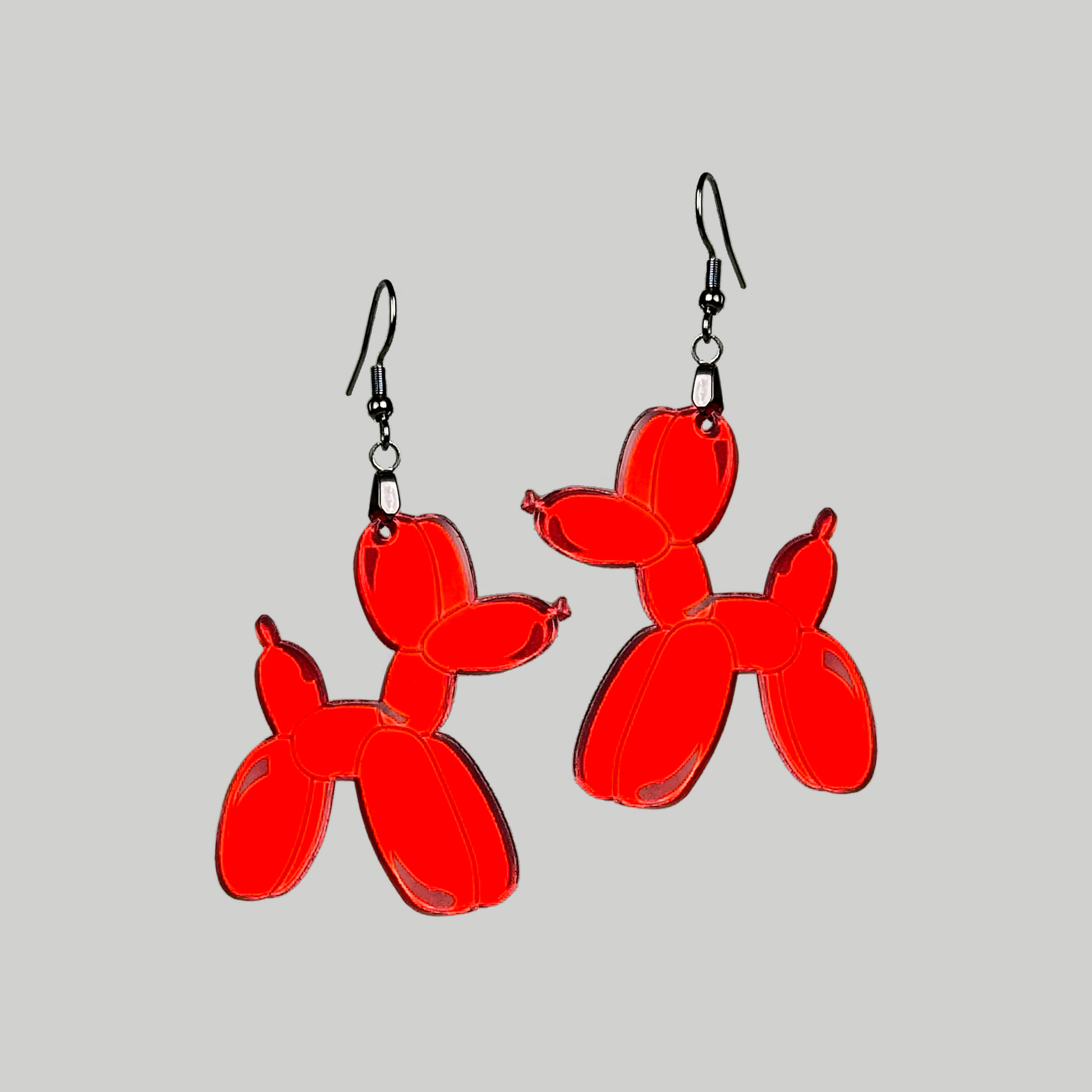 Earrings featuring a balloon animal-shaped dog, a playful and charming accessory to showcase your love for whimsical design.