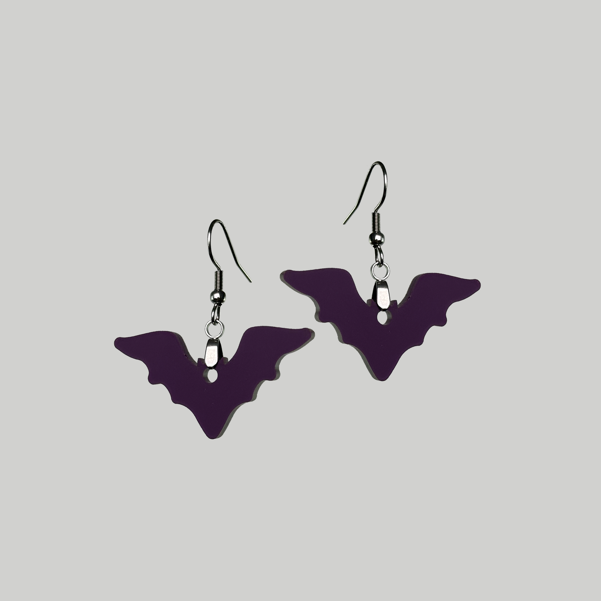 Sleek Bat Silhouette Earrings: Edgy and modern, these bat-inspired earrings make a bold fashion statement.