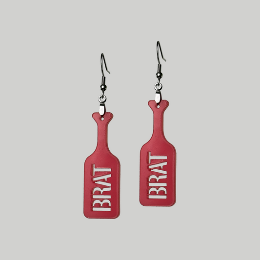 Brat Paddle Earrings: Edgy and provocative, these earrings feature miniature brat paddles for a bold and unique statement. Red in color
