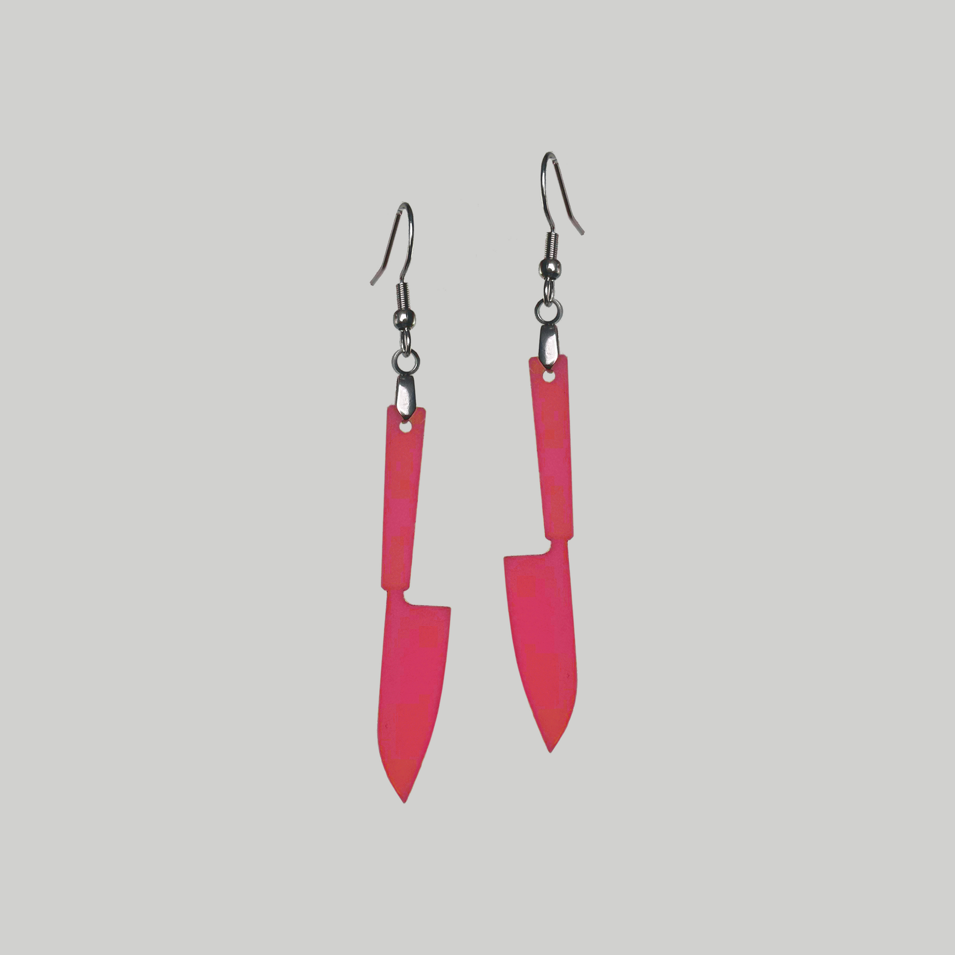 Knife Outline Elegance Earrings: Stylish accessories showcasing miniature knife motifs for a distinctive statement