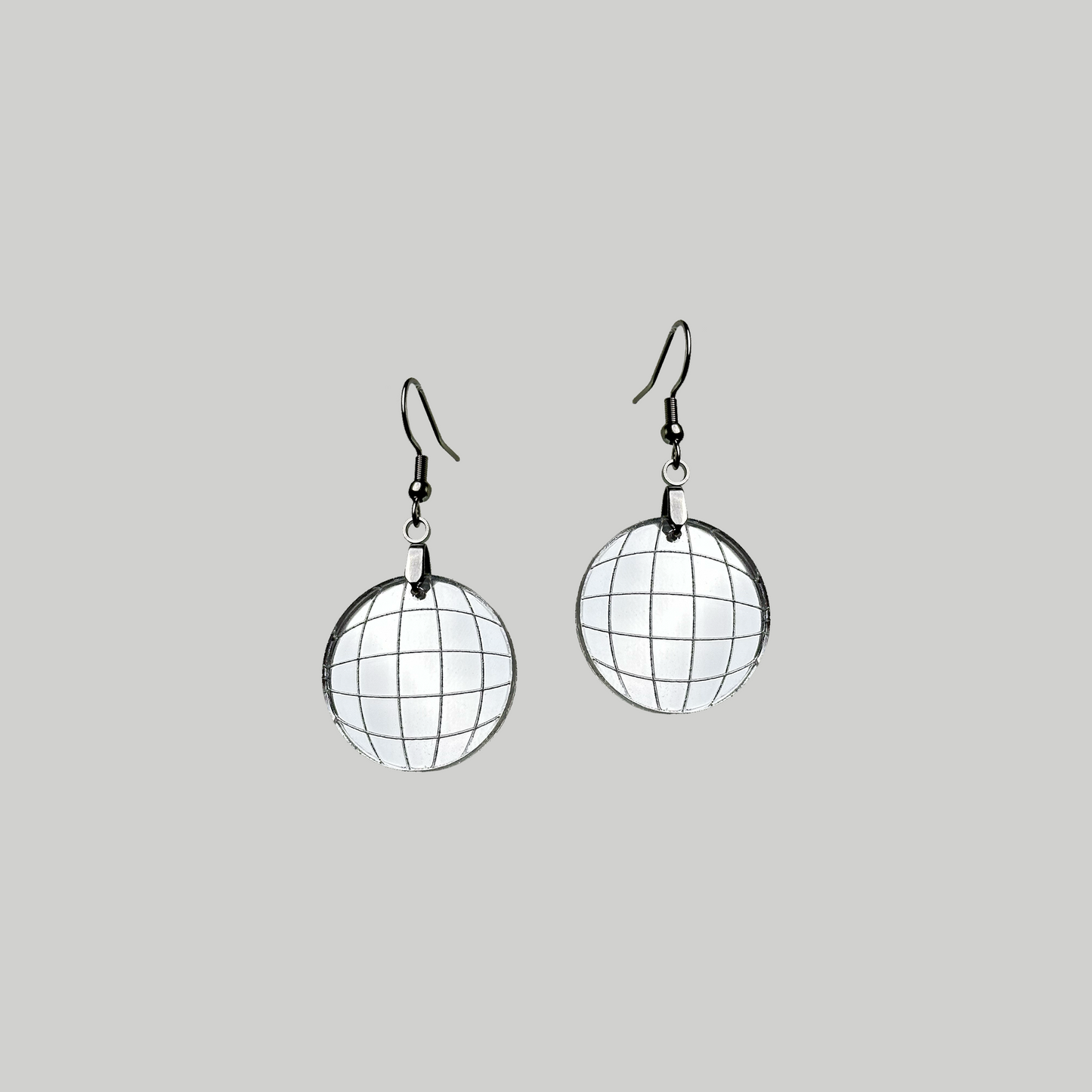 Earrings resembling shiny disco balls, crafted from etched mirrored acrylic for a glamorous and reflective dance of light.