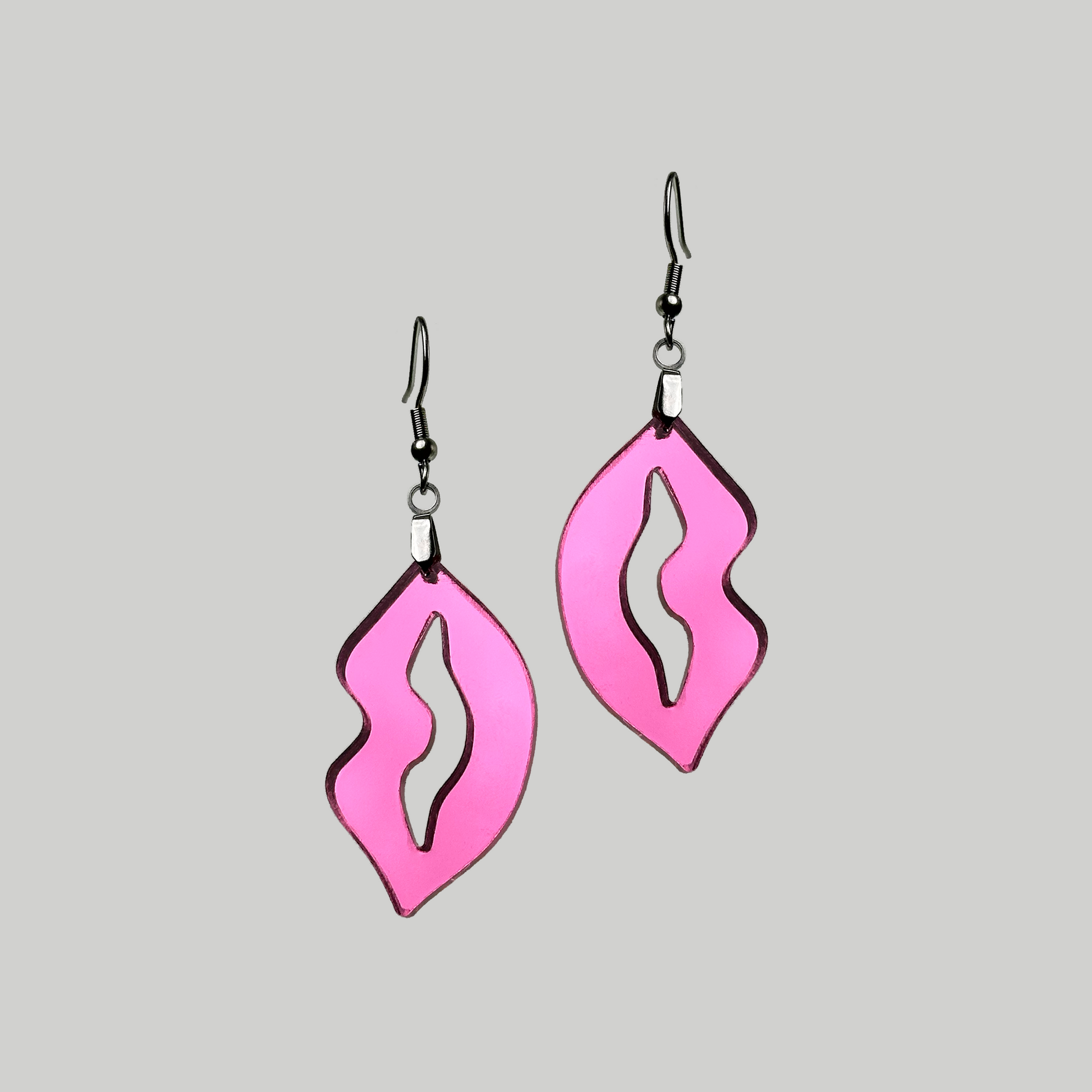Glossy lip-shaped earrings with a sleek outline, perfect for making a statement and enhancing your overall look.