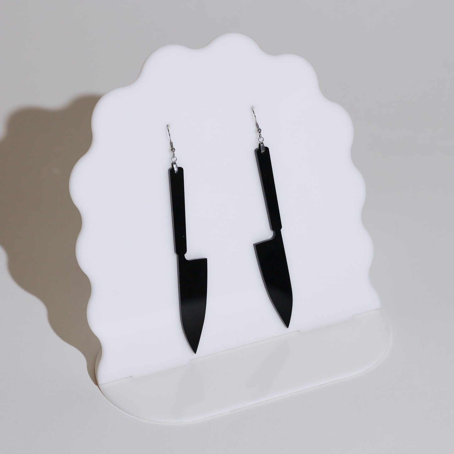 Cutting-Edge Fashion Earrings: Unique and eye-catching, these earrings feature knife motifs for a bold and modern look. Created by Our Family Designs.