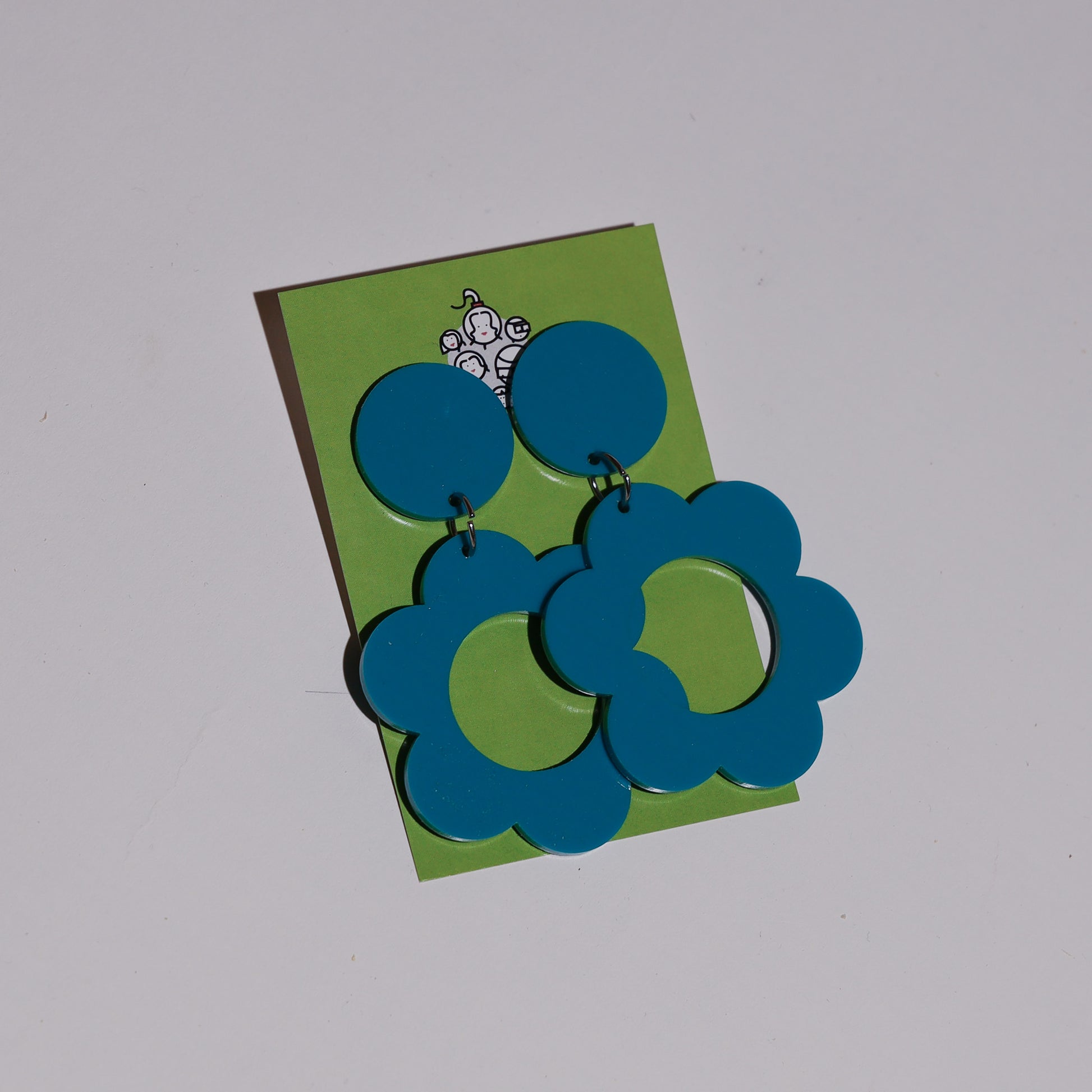 teal flower clip on earring